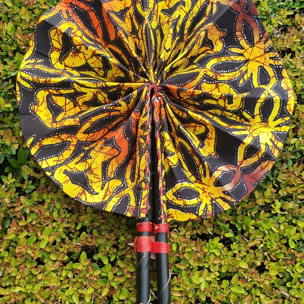 African Ankara Print Folding Fan . Made With Leather Handles .